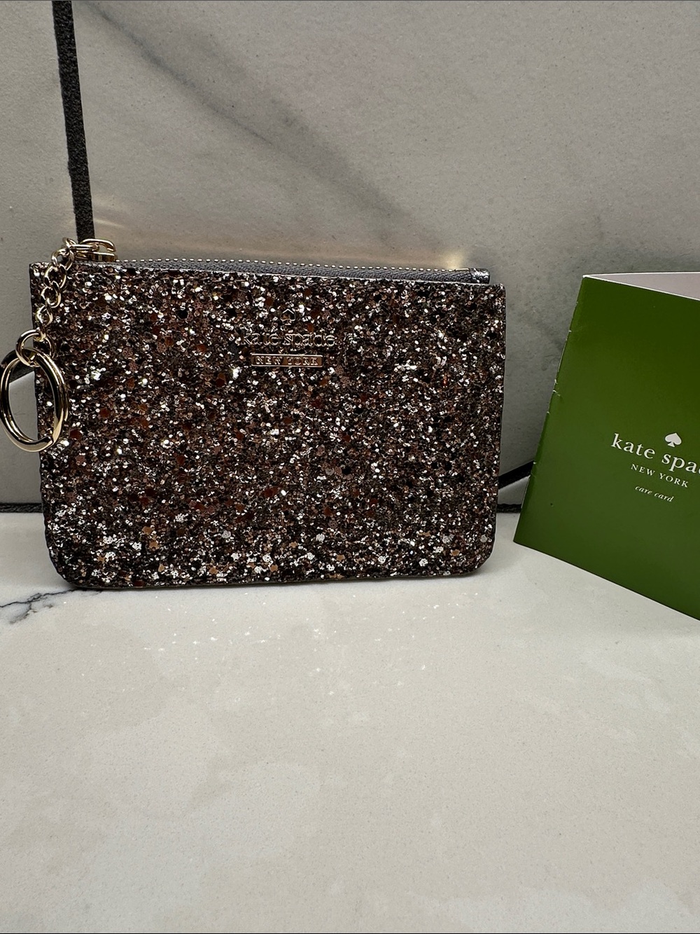 kate spade glitter key pouch in Bling silver